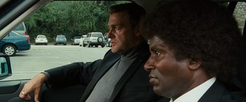 Movie still from “The Other Guys” (2010), directed by Adam McKay – Two men sitting in the back seat of a car; Close Up shot, Over the shoulder angle