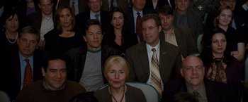 Movie still from “The Other Guys” (2010), directed by Adam McKay – A group of people sitting in front of each other; Medium shot, Over the shoulder angle