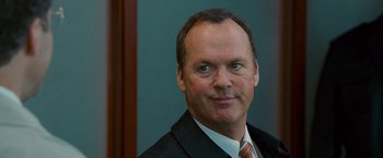 Movie still from “The Other Guys” (2010), directed by Adam McKay – A person wearing a suit and tie; Close Up shot, Over the shoulder angle