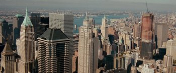 Movie still from “The Other Guys” (2010), directed by Adam McKay – An aerial view of a large city with skyscrapers; Extreme Wide shot, High angle