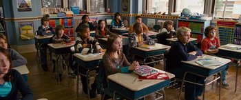 Movie still from “The Other Guys” (2010), directed by Adam McKay – A group of children sitting at desks in a classroom; Wide shot, High angle