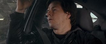 Movie still from “The Other Guys” (2010), directed by Adam McKay – A person in a car; Close Up shot, Over the shoulder angle