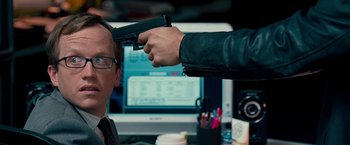 Movie still from “The Other Guys” (2010), directed by Adam McKay – A man holding a gun up to his head; Close Up shot, Over the shoulder angle