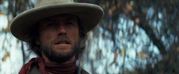 Movie still from “The Outlaw Josey Wales” (1976), directed by Clint Eastwood – A person wearing a cowboy hat; Close Up shot, Low angle