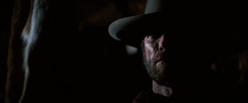 Movie still from “The Outlaw Josey Wales” (1976), directed by Clint Eastwood – A person wearing a cowboy hat; Close Up shot, Low angle