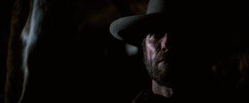 Movie still from “The Outlaw Josey Wales” (1976), directed by Clint Eastwood – A person wearing a cowboy hat; Close Up shot, Low angle