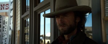 Movie still from “The Outlaw Josey Wales” (1976), directed by Clint Eastwood – A person wearing a hat; Close Up shot, Low angle