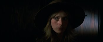 Movie still from “The Outlaw Josey Wales” (1976), directed by Clint Eastwood – A woman wearing a hat in the dark; Close Up shot, Low angle