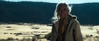 Movie still from “The Outlaw Josey Wales” (1976), directed by Clint Eastwood – An old woman standing in the middle of the desert; Medium shot, Over the shoulder angle