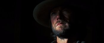Movie still from “The Outlaw Josey Wales” (1976), directed by Clint Eastwood – A person wearing a hat; Close Up shot, Low angle