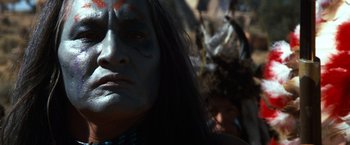 Movie still from “The Outlaw Josey Wales” (1976), directed by Clint Eastwood – A person with a face paint; Close Up shot, Low angle