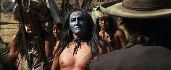 Movie still from “The Outlaw Josey Wales” (1976), directed by Clint Eastwood – A group of native american men standing next to each other; Medium shot, Low angle