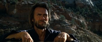 Movie still from “The Outlaw Josey Wales” (1976), directed by Clint Eastwood – A person wearing a shirt; Close Up shot, Low angle