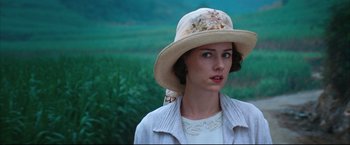 Movie still from “The Painted Veil” (2006), directed by John Curran – A woman wearing a hat and a white jacket; Close Up shot, Over the shoulder angle