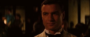 Movie still from “The Painted Veil” (2006), directed by John Curran – A person wearing a suit and tie; Close Up shot, Over the shoulder angle