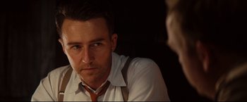 Movie still from “The Painted Veil” (2006), directed by John Curran – A person wearing a shirt and a tie; Close Up shot, Over the shoulder angle