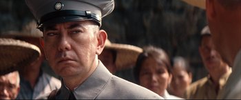 Movie still from “The Painted Veil” (2006), directed by John Curran – A man wearing a uniform and a hat; Close Up shot, Low angle