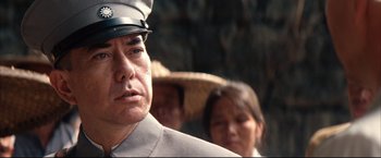 Movie still from “The Painted Veil” (2006), directed by John Curran – A man wearing a hat and a uniform; Close Up shot, Low angle