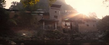 Movie still from “The Painted Veil” (2006), directed by John Curran – People are swimming in a river near a building; Extreme Wide shot, Low angle