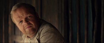 Movie still from “The Painted Veil” (2006), directed by John Curran – A person sitting in front of a window; Close Up shot, Over the shoulder angle