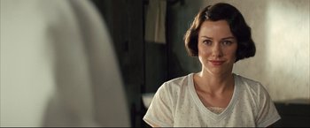 Movie still from “The Painted Veil” (2006), directed by John Curran – A woman in a white shirt is looking at a mirror; Close Up shot, Over the shoulder angle