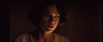 Movie still from “The Painted Veil” (2006), directed by John Curran – A person in a dark room; Close Up shot, Low angle