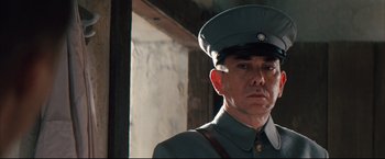 Movie still from “The Painted Veil” (2006), directed by John Curran – A person wearing a uniform; Close Up shot, Low angle