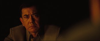 Movie still from “The Painted Veil” (2006), directed by John Curran – A person in a dark room; Close Up shot, Low angle