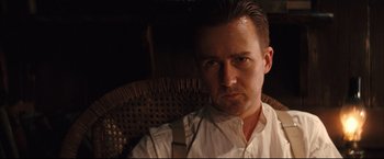 Movie still from “The Painted Veil” (2006), directed by John Curran – A person sitting in a chair; Close Up shot, Low angle