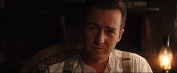 Movie still from “The Painted Veil” (2006), directed by John Curran – A person sitting in a chair; Close Up shot, Over the shoulder angle