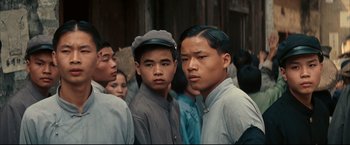 Movie still from “The Painted Veil” (2006), directed by John Curran – A group of men standing next to each other; Close Up shot, High angle