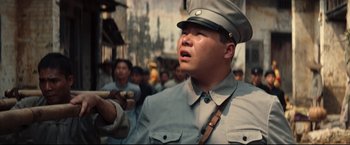 Movie still from “The Painted Veil” (2006), directed by John Curran – A man in a military uniform is looking up at the sky; Close Up shot, Low angle