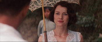 Movie still from “The Painted Veil” (2006), directed by John Curran – A woman holding an umbrella while standing next to a man; Close Up shot, Over the shoulder angle