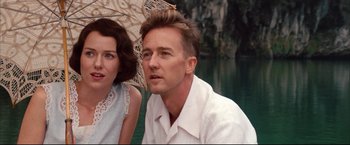 Movie still from “The Painted Veil” (2006), directed by John Curran – A man and a woman sitting next to each other in front of a body of water; Close Up shot, Over the shoulder angle