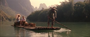 Movie still from “The Painted Veil” (2006), directed by John Curran – A man on a raft in the middle of a river; Wide shot, Low angle