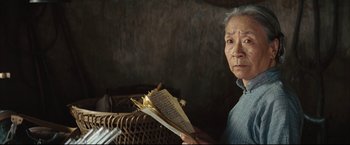 Movie still from “The Painted Veil” (2006), directed by John Curran – An older man holding a piece of paper in his hands; Close Up shot, Over the shoulder angle