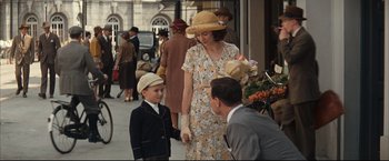 Movie still from “The Painted Veil” (2006), directed by John Curran – A woman and a man talking to a young boy; Medium shot, Over the shoulder angle