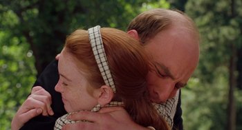Movie still from “The Parent Trap” (1998), directed by Nancy Meyers – A man and a woman embracing each other; Close Up shot, Over the shoulder angle