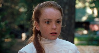 Movie still from “The Parent Trap” (1998), directed by Nancy Meyers – A young girl with red hair wearing a white shirt; Close Up shot, High angle