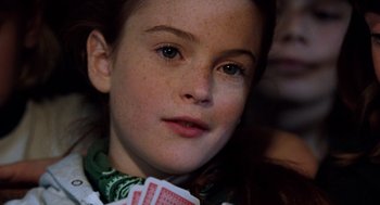 Movie still from “The Parent Trap” (1998), directed by Nancy Meyers – A young girl is holding a deck of cards; Close Up shot, High angle
