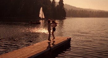 Movie still from “The Parent Trap” (1998), directed by Nancy Meyers – Two people walking on a dock near a lake; Extreme Wide shot, High angle