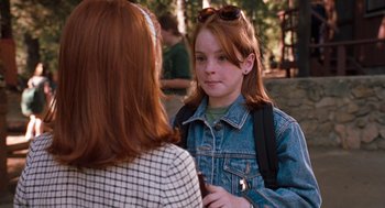 Movie still from “The Parent Trap” (1998), directed by Nancy Meyers – A young girl wearing a jean jacket talking to a woman; Close Up shot, Over the shoulder angle