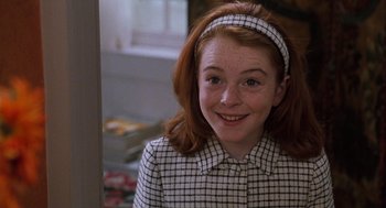 Movie still from “The Parent Trap” (1998), directed by Nancy Meyers – A young woman with red hair and a checkered jacket; Close Up shot, High angle