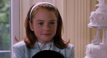 Movie still from “The Parent Trap” (1998), directed by Nancy Meyers – A young girl with red hair and a white headband; Close Up shot, High angle
