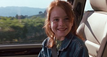 Movie still from “The Parent Trap” (1998), directed by Nancy Meyers – A girl sitting in the driver's seat of a car; Close Up shot, High angle
