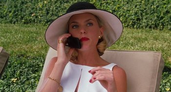 Movie still from “The Parent Trap” (1998), directed by Nancy Meyers – A woman wearing a hat talking on a cell phone; Medium shot, Low angle