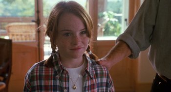 Movie still from “The Parent Trap” (1998), directed by Nancy Meyers – A girl with red hair is getting her hair combed; Medium shot, Over the shoulder angle