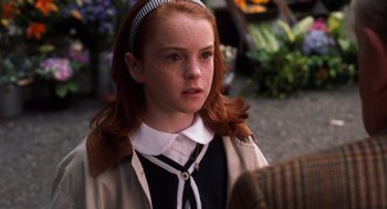 Movie still from “The Parent Trap” (1998), directed by Nancy Meyers – A young girl with red hair and a black and white shirt; Close Up shot, Over the shoulder angle