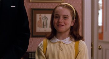 Movie still from “The Parent Trap” (1998), directed by Nancy Meyers – A young girl with red hair wearing a yellow sweater; Close Up shot, High angle
