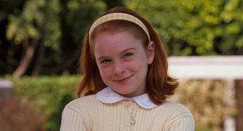 Movie still from “The Parent Trap” (1998), directed by Nancy Meyers – A young girl with red hair wearing a headband; Close Up shot, High angle